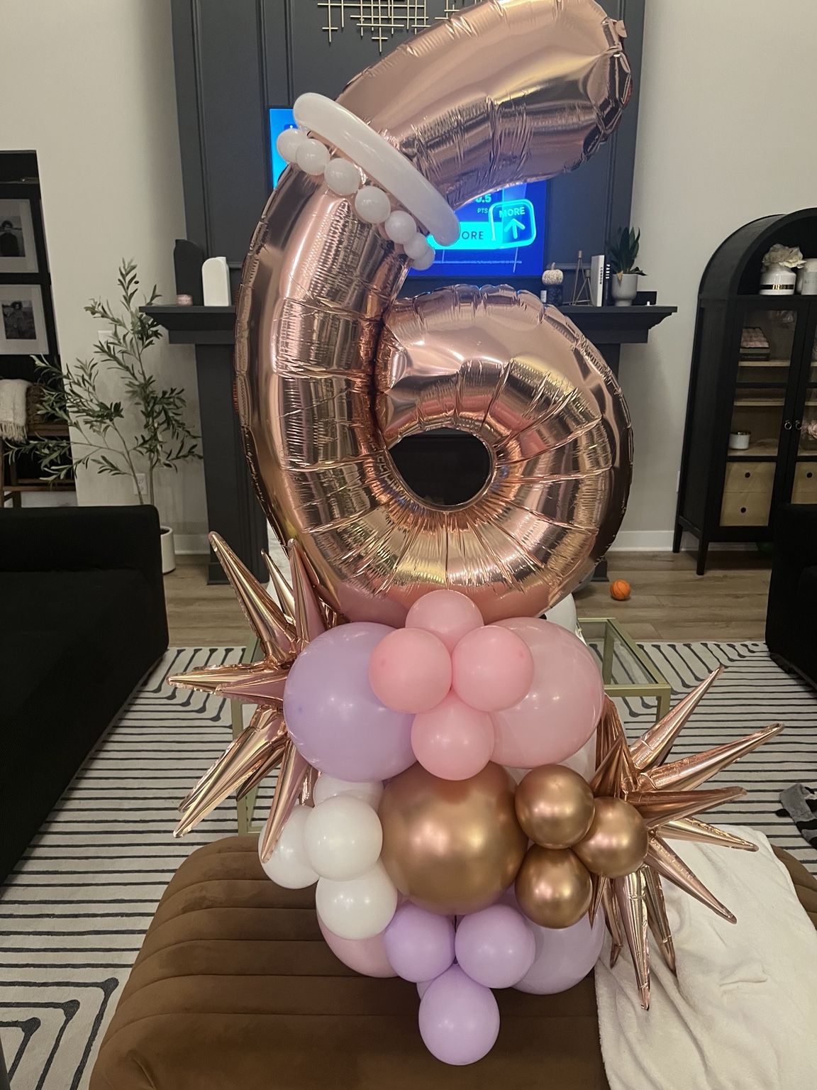 Rose-gold number six balloon stack with blush, lilac and metallic accents
