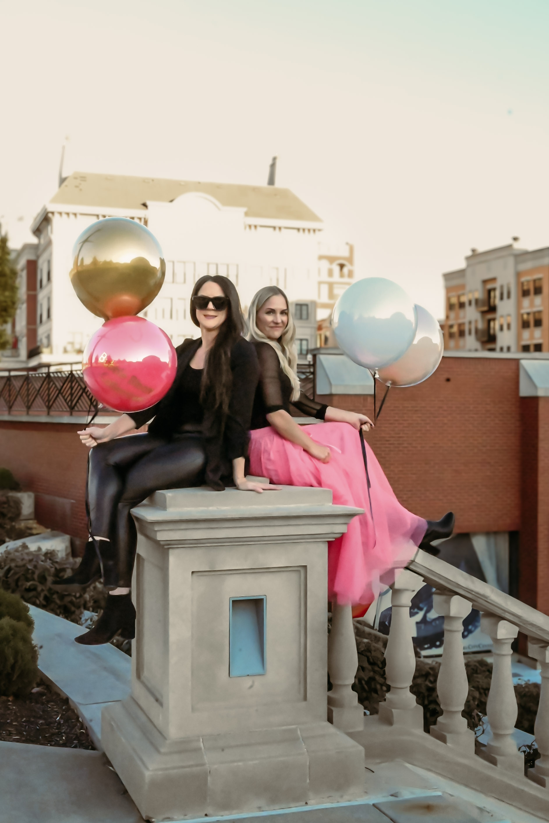 Bubble Bloom Collective founders Victoria Joyce and Maura Kennedy together with balloons