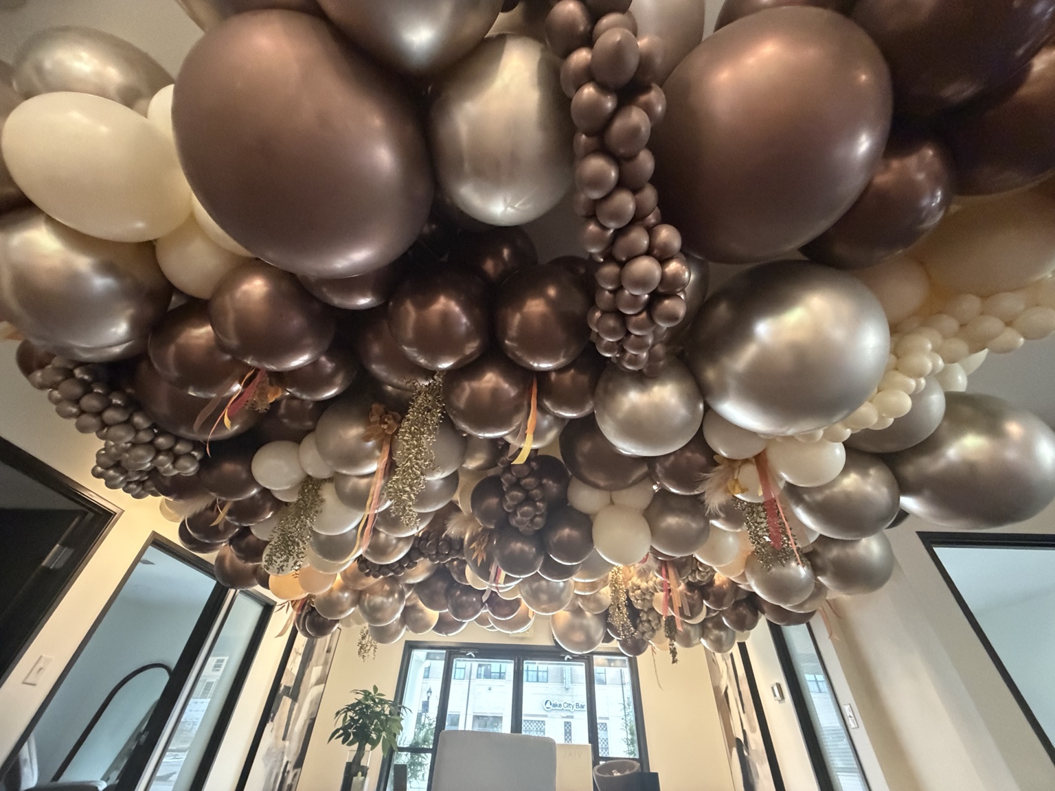 Dramatic metallic balloon ceiling installation by Bubble Bloom Collective in Westfield